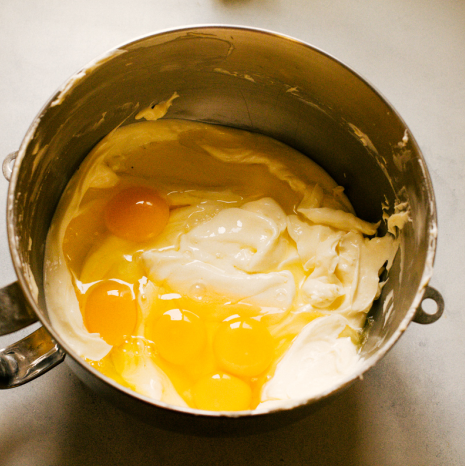 adding eggs to batter